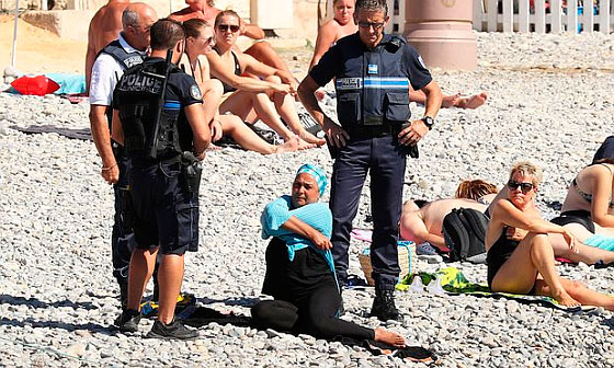 French police make woman remove clothing on Nice beach following Burkini ban