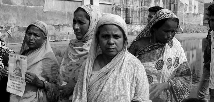 Mothers whose children died when Rana Plaza collapsed gather at site of the factory. Picture: Tansy Hoskins